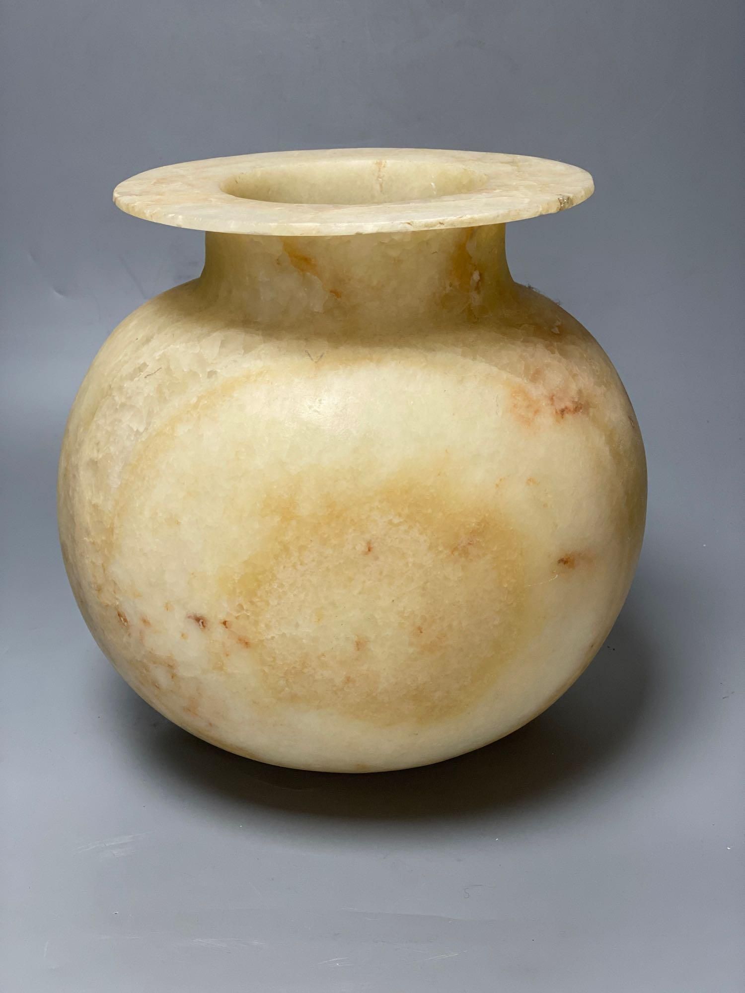 An alabaster bowl with everted rim, height 27cm